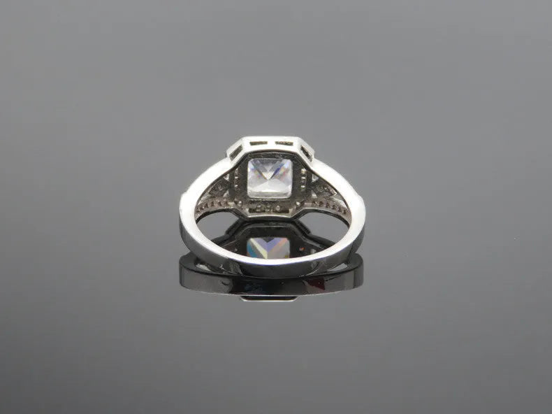 Geometric hollow zircon ring with quadrilateral design in platinum colour on copper