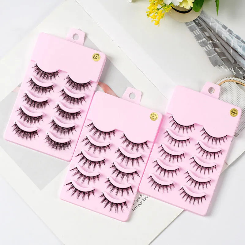 Five pairs of natural wispy manga false eyelashes in a tray, anime cosplay makeup style