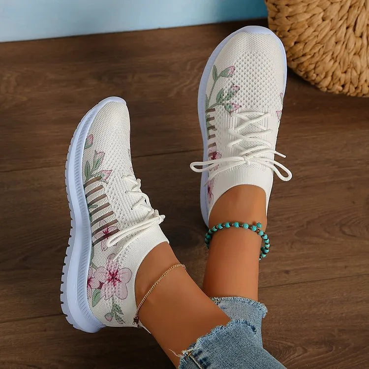 Women's Milky White mesh Flyknit running shoes with a round toe and flat rubber sole.