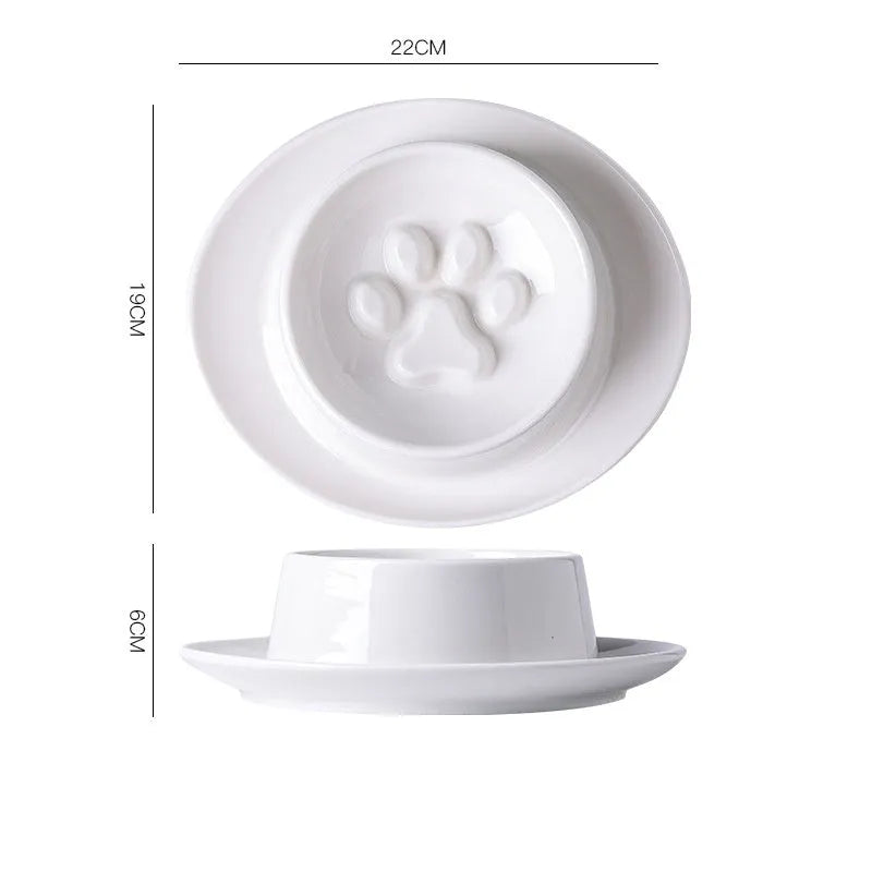 Green ceramic slow feed pet bowl with raised interior ridges and a non-slip black rubber base.