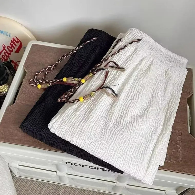 Korean-style men's loose straight-leg trousers with drooping texture in black or white for summer casual wear