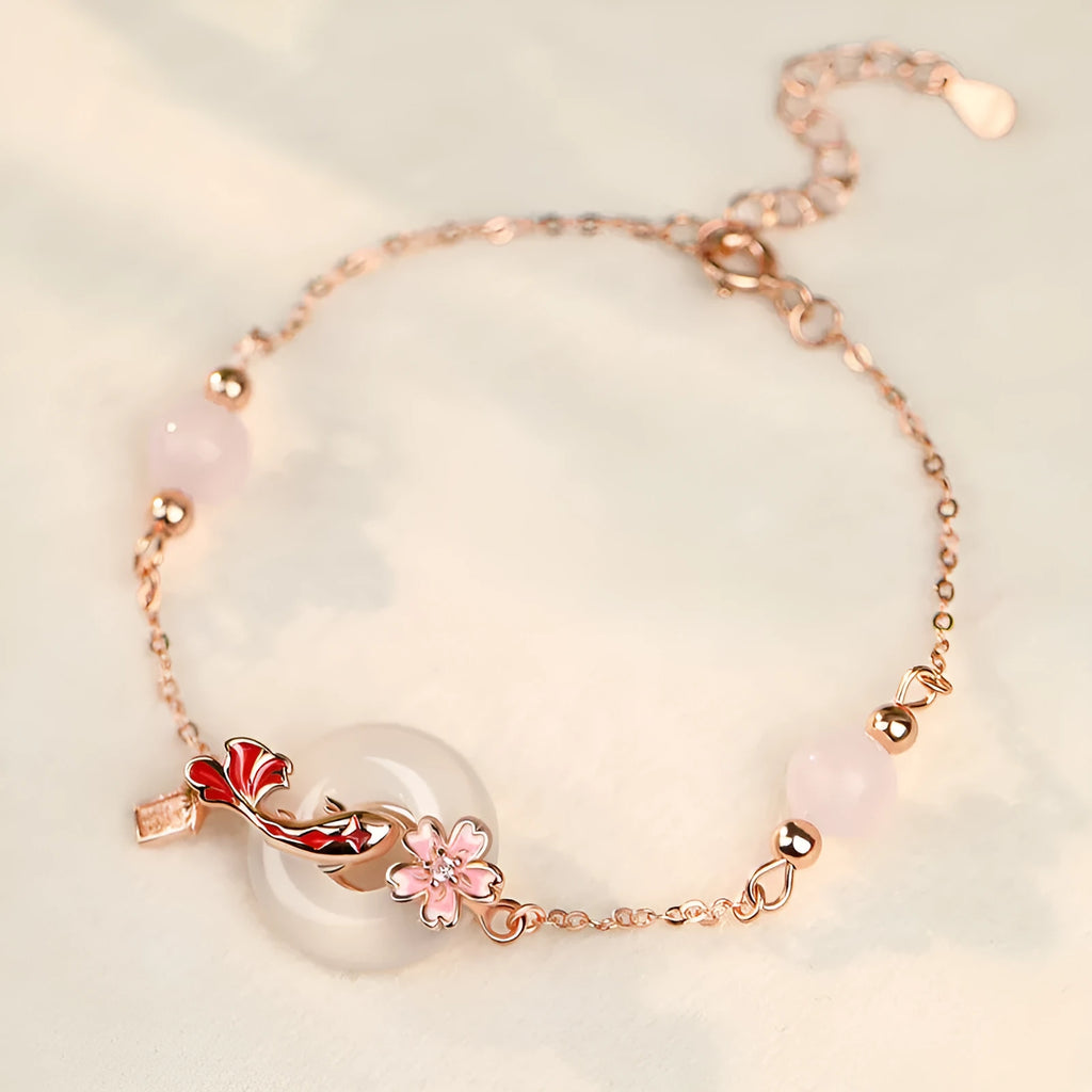 S925 sterling silver bracelet with Chinese flower design and white chalcedony crystal accents featuring koi fish motif