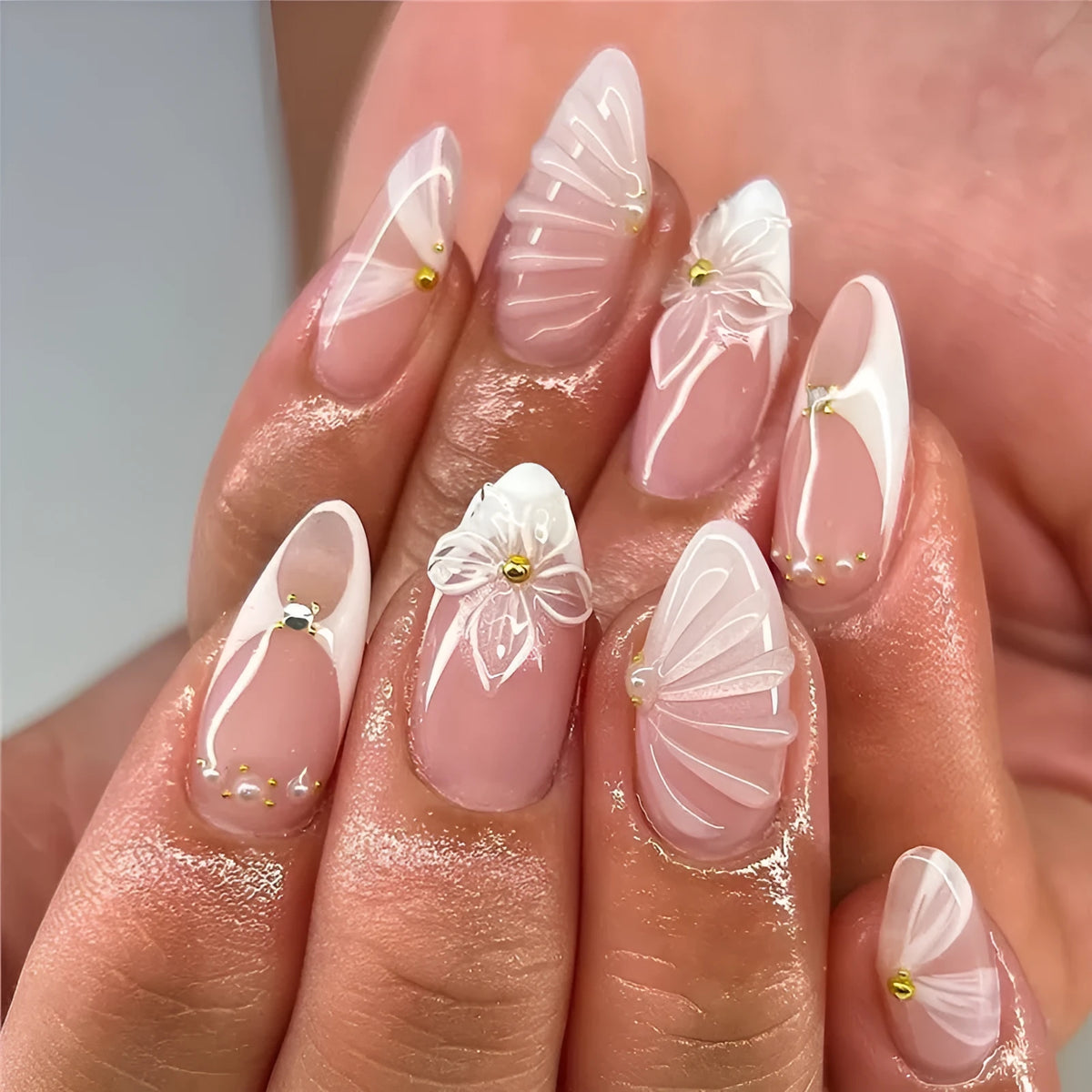 White almond fake nails with three-dimensional water ripple finish and flower pattern in colour AA214