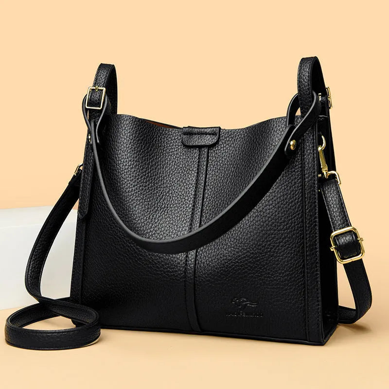 Brown retro-style ladies shoulder bag with single strap showing sewing line detailing and organisational compartments