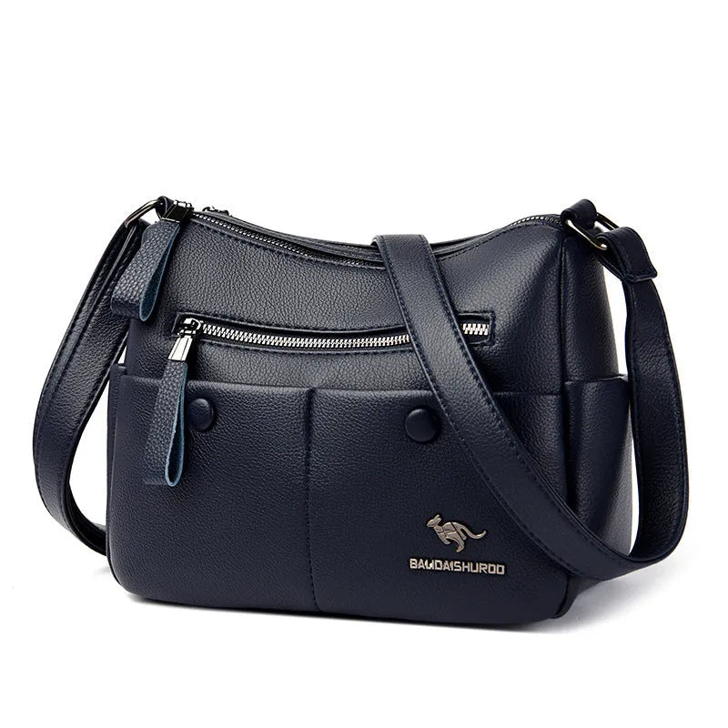 Soft black PU leather women's crossbody bag showing external pockets and a horizontal square shape.