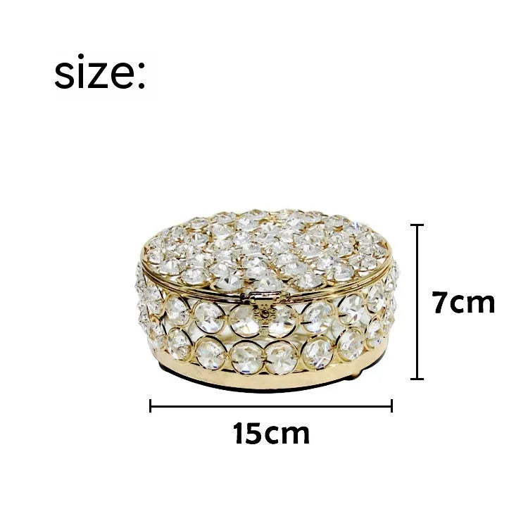Transparent crystal glass jewelry box with a French gold metal frame in a European style.