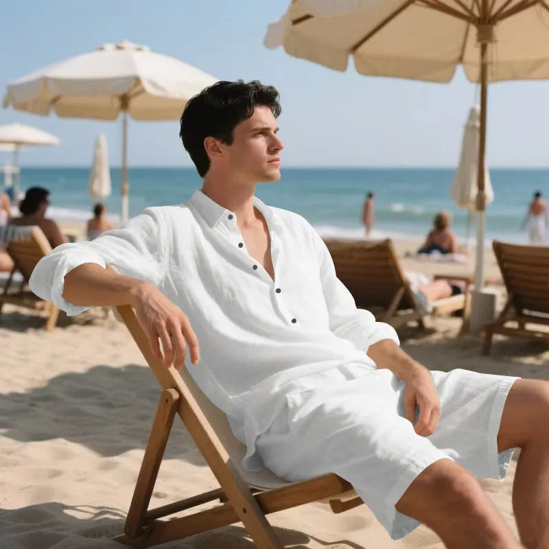 Men's linen beach suit consisting of a long sleeve shirt and shorts, shown in light blue colour.