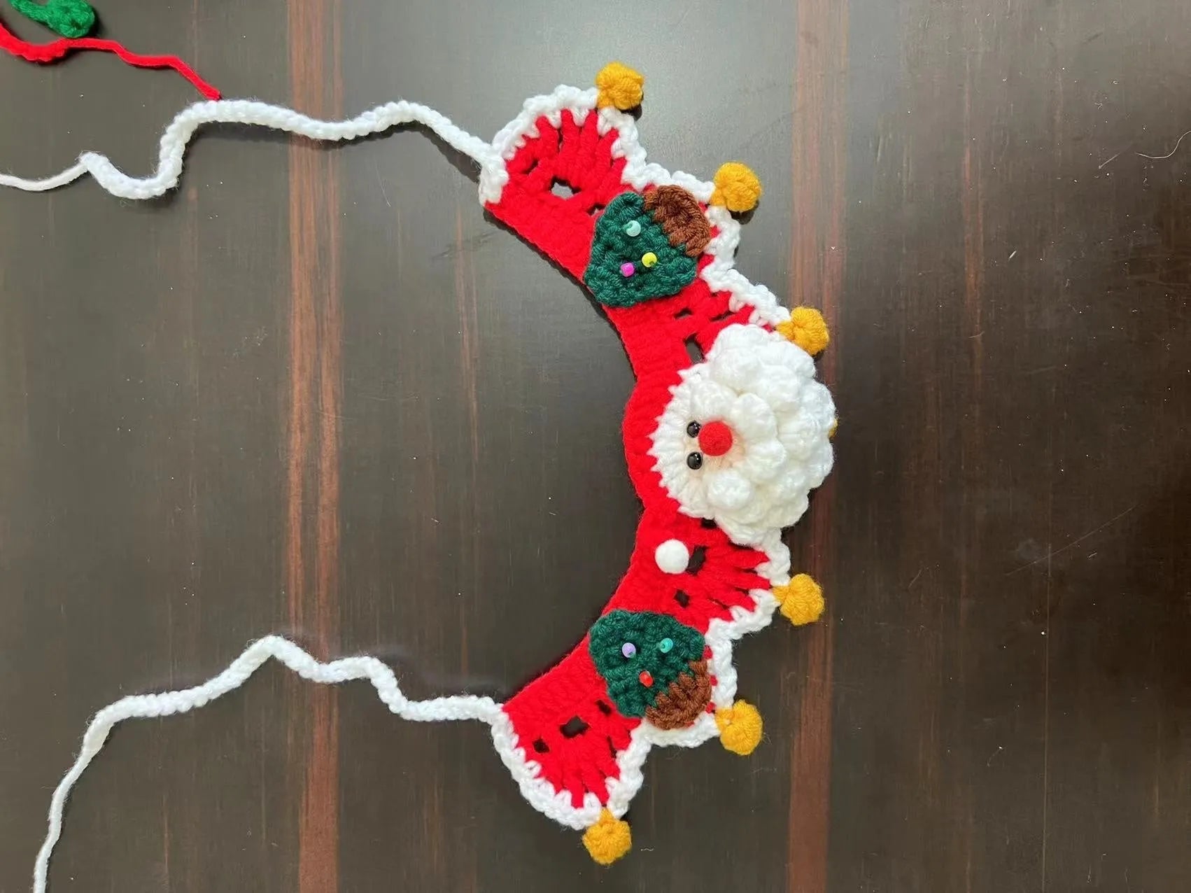 Knitted wool Christmas pet scarf clipped to dog collar in striped Santa pattern
