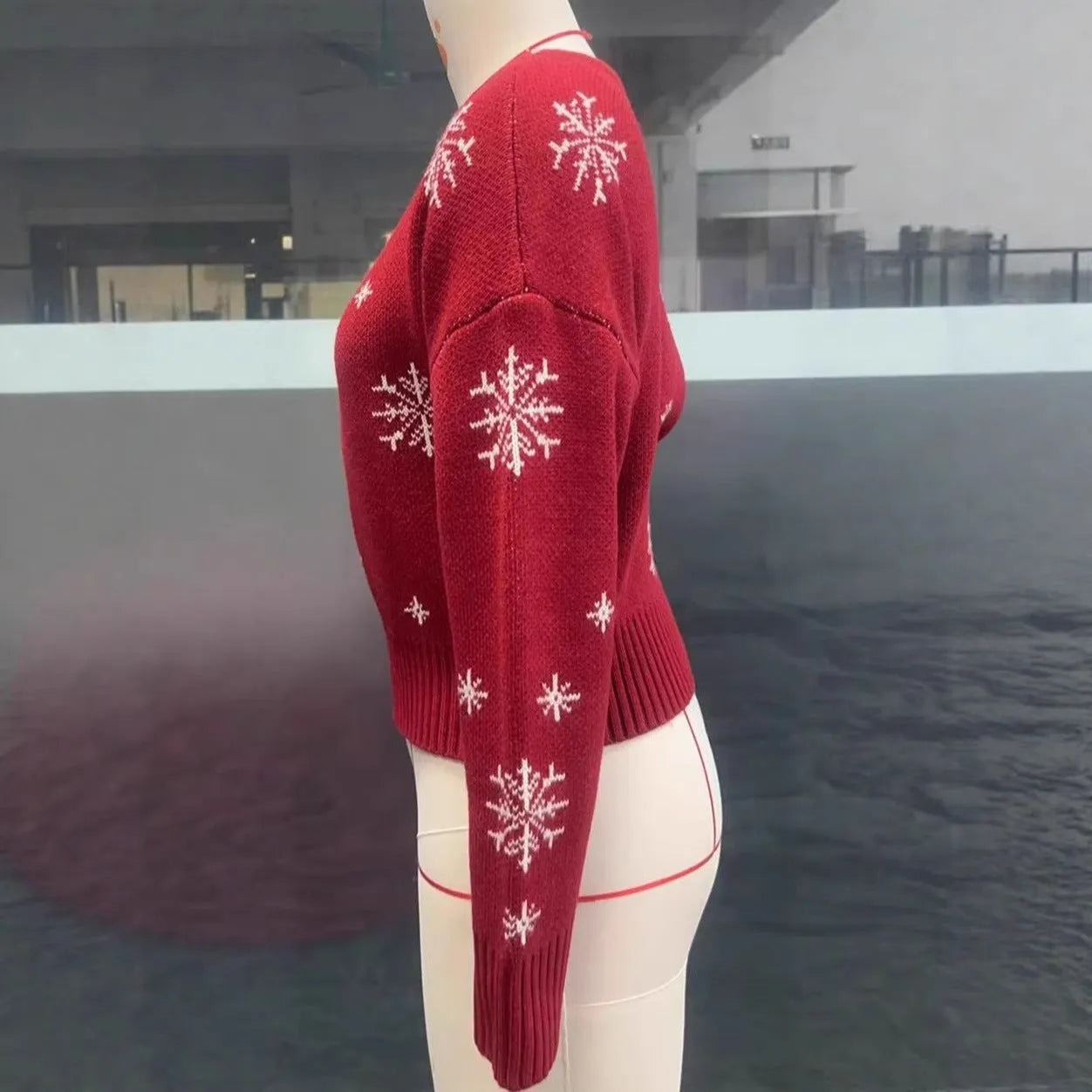 Women's snowflake jacquard pullover Christmas sweater in red with crocheted flowers and boat neck