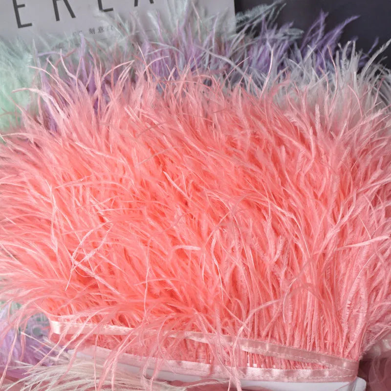 Decorative feather cloth strip in multiple colours including white, black, and mint green for DIY clothing and craft projects