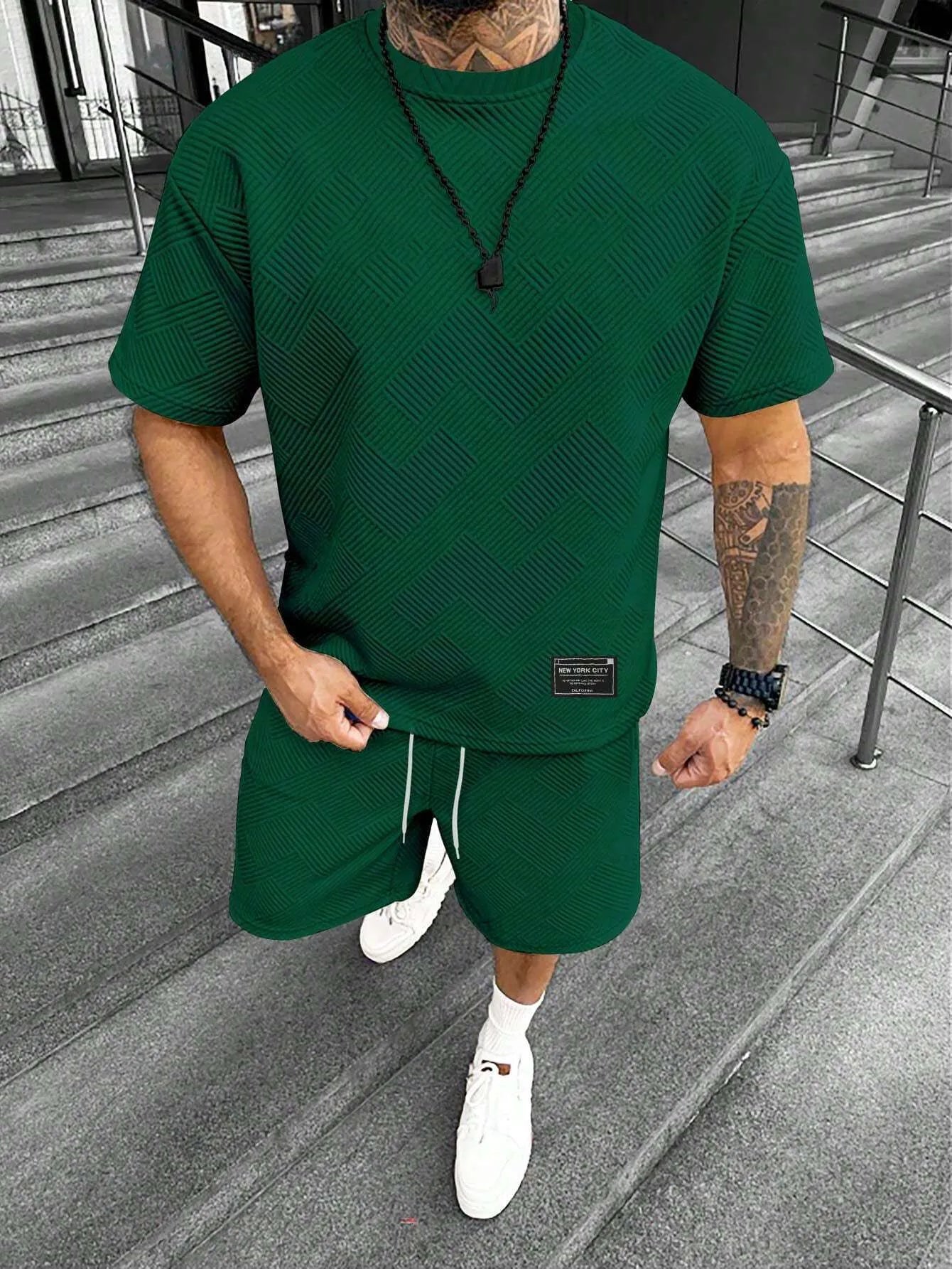 Men's short sleeve top and shorts suit with 3D printed pattern for sport and leisure wear.