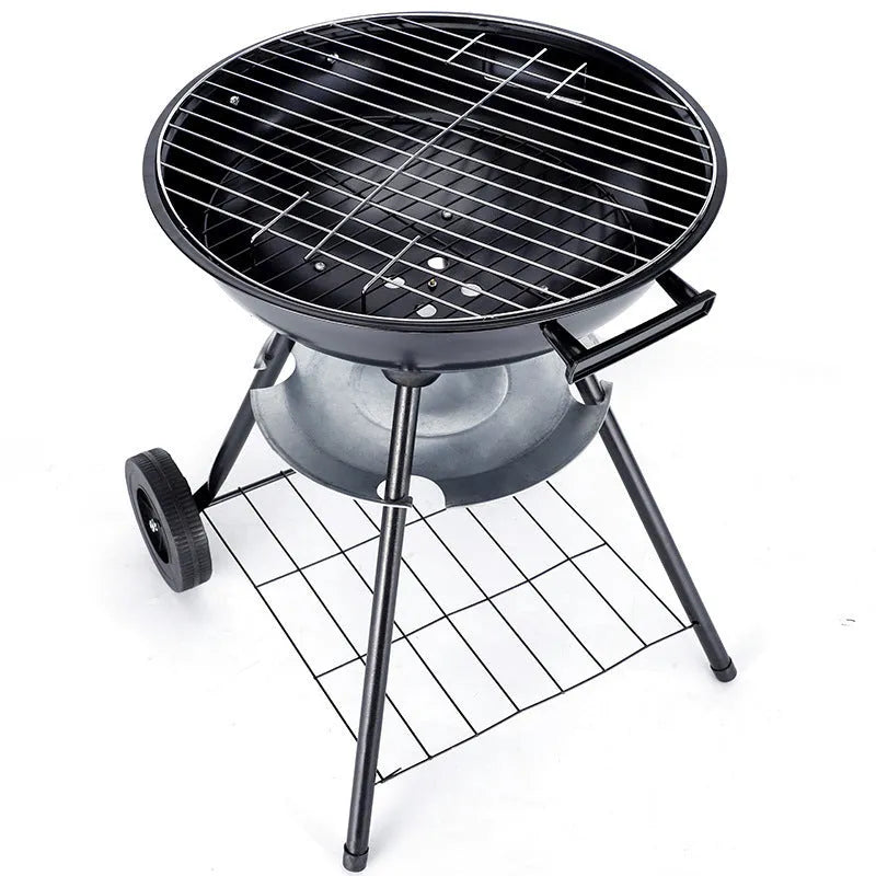 A compact, circular portable barbecue oven with a 14-inch cast iron grill grate, shown on a patio.