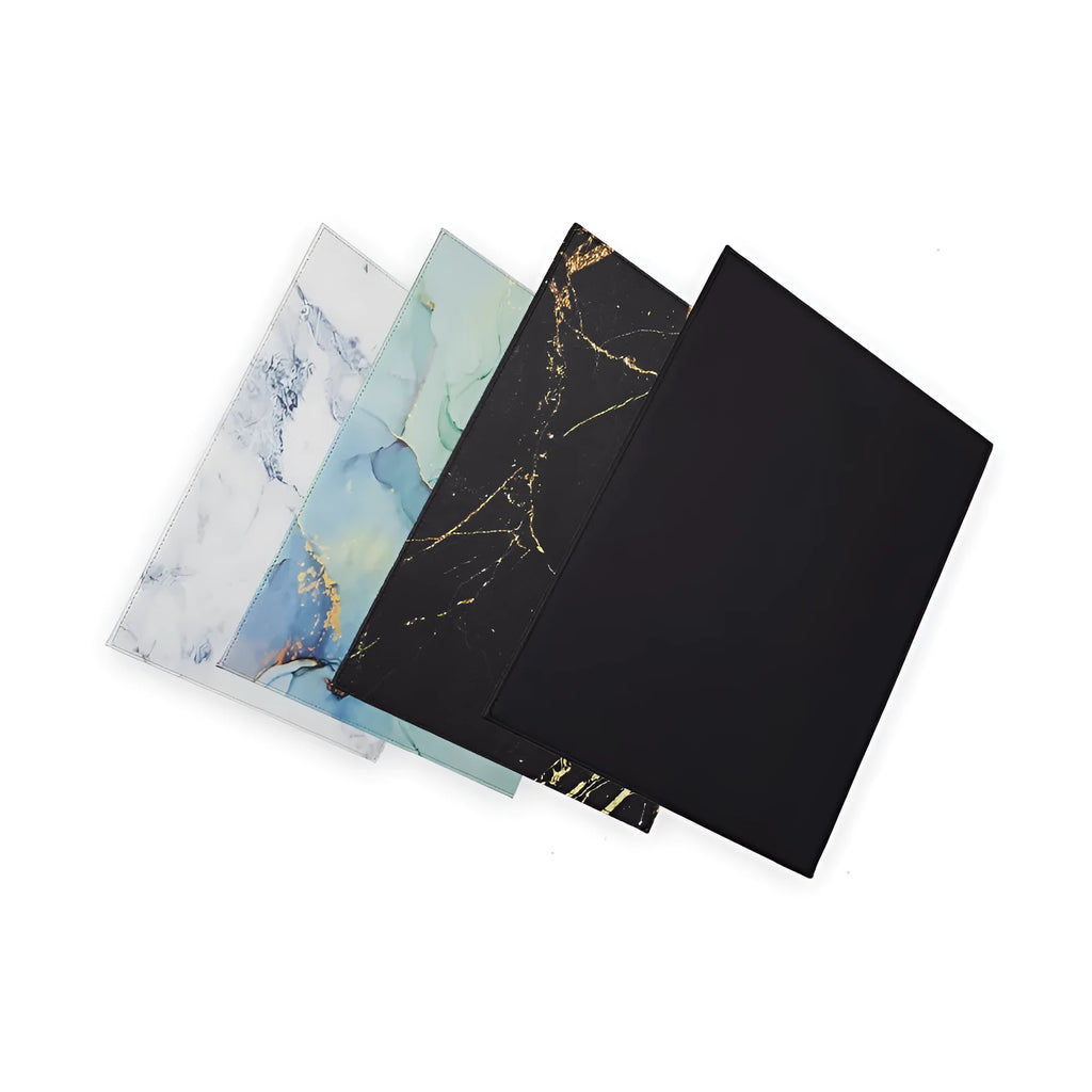 Durable black laptop cooling pad with printing pattern and anti-radiation features on a desk.