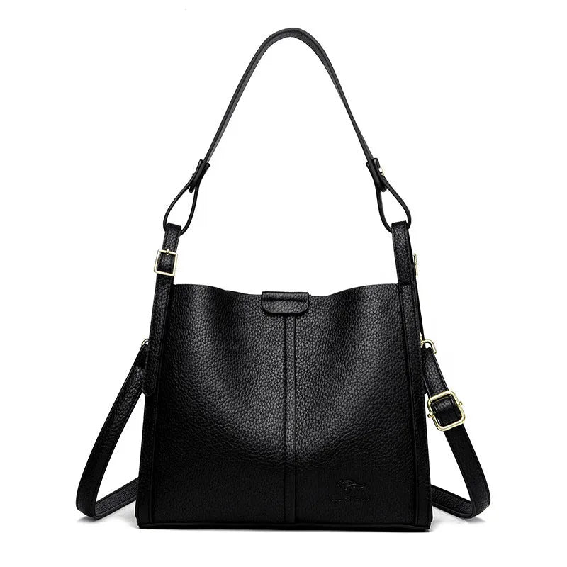 Brown retro-style ladies shoulder bag with single strap showing sewing line detailing and organisational compartments