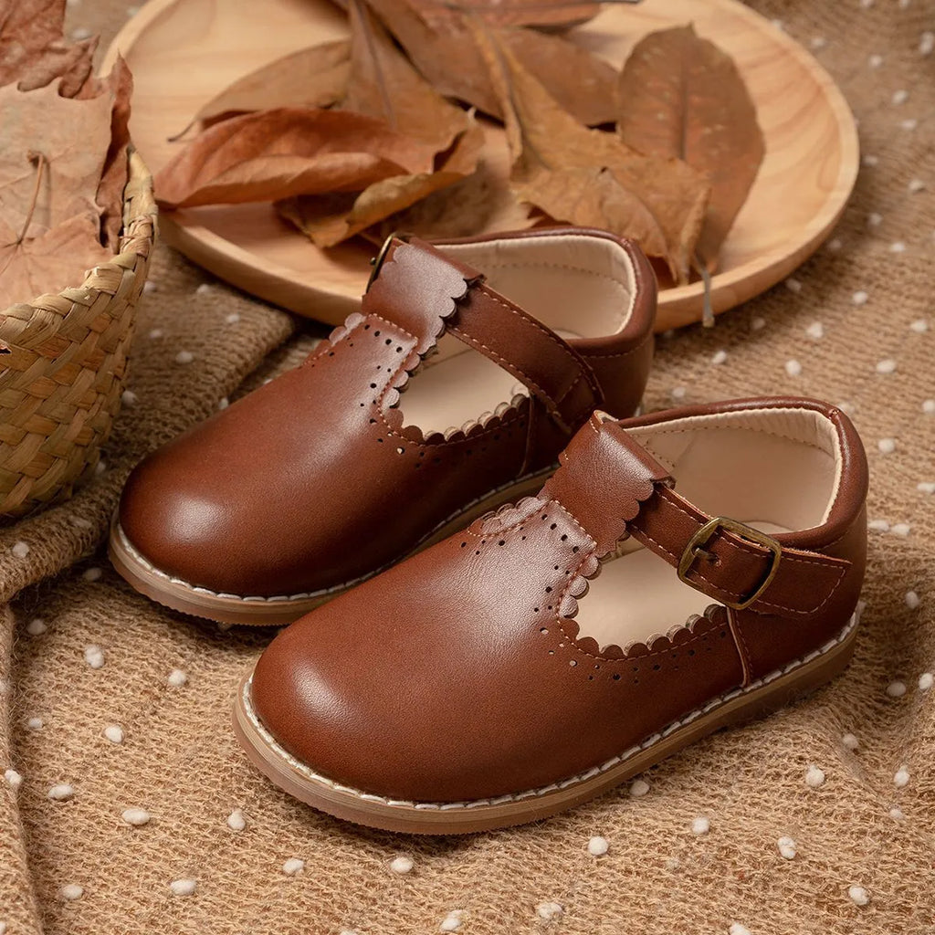 Girls British style PU leather shoes with hollow breathable upper and Velcro fastening, available in black