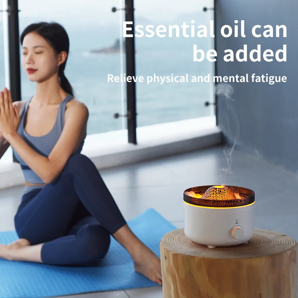 White simulated flame volcano humidifier and aroma diffuser with remote control on wooden surface
