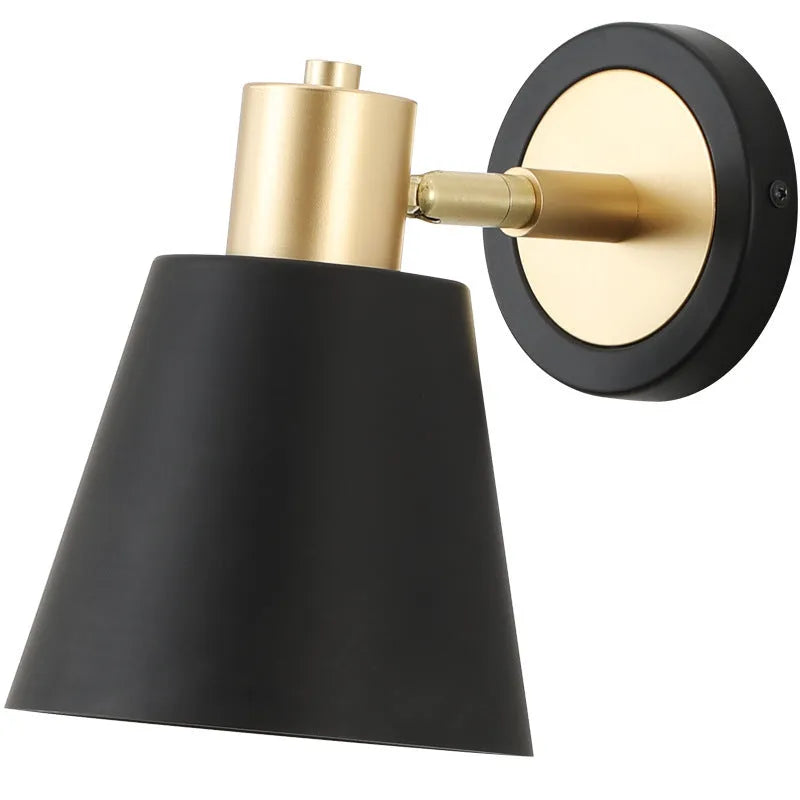 Nordic-style iron wall lamp mounted on a wall beside a bed.