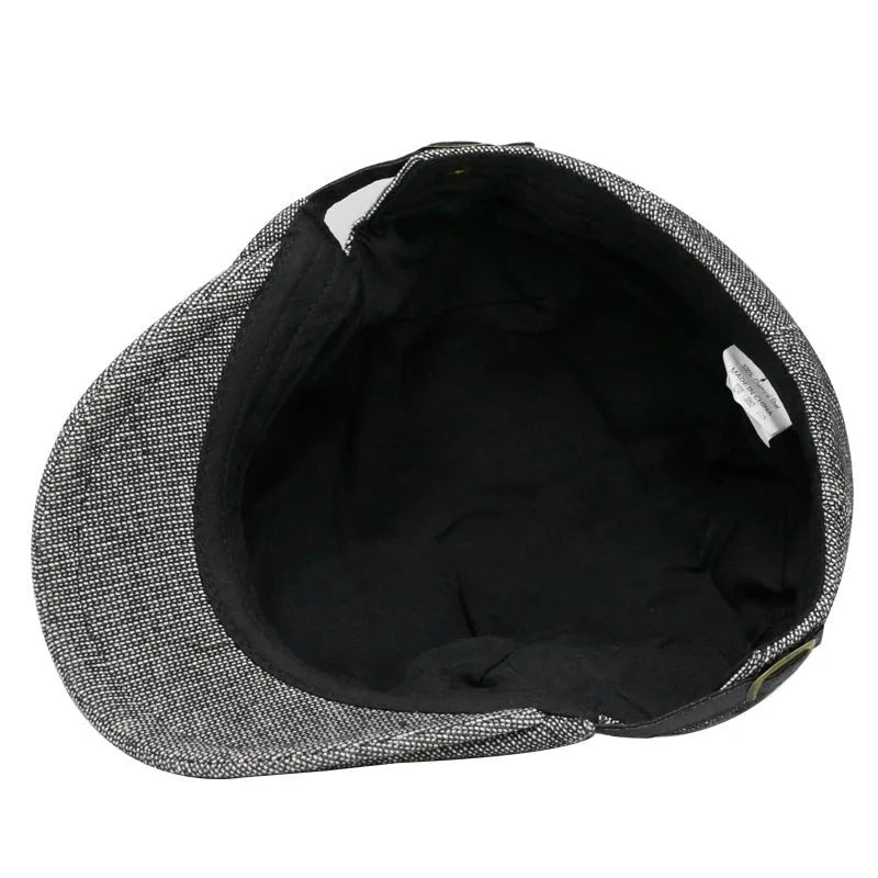 Men's cotton linen blend beret hat in black on a model, showing dome crown style.