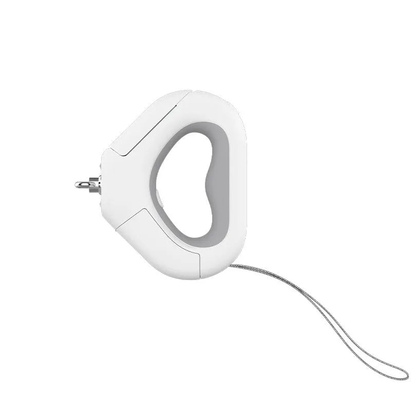 White plastic pet leashing device with integrated spotlight light and snack bin box on a table