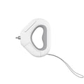 White plastic pet leashing device with integrated spotlight light and snack bin box on a table