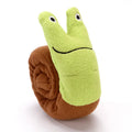 Green frog-shaped velvet dog squeak toy with hidden food holes for foraging puzzles.