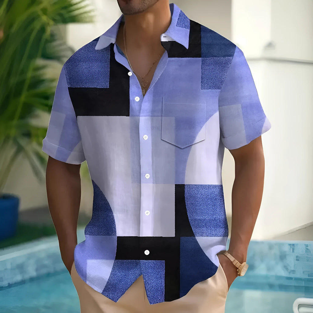 Man wearing a loose-fit short sleeve cardigan shirt with a blue and white 3D printed geometric square pattern.
