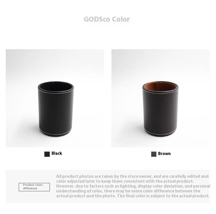 Small round black leather pen holder on a desk.