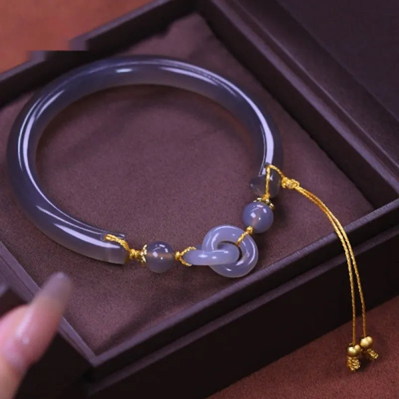 Smoke purple agate half bracelet with ring buckle closure on grey background