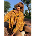 Dopamine Yellow and black plaid pattern on a loose-fitting unisex cardigan-style shirt.
