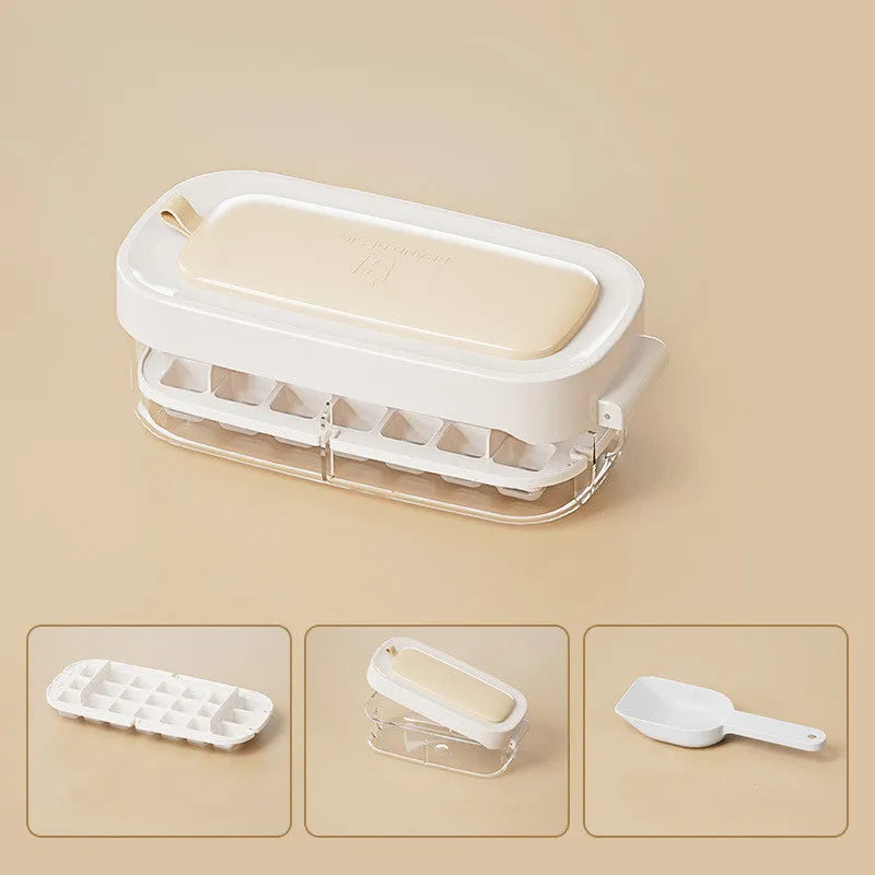 A blue high-capacity ice cube tray with a lever mechanism for easy demoulding and a stored ice shovel.