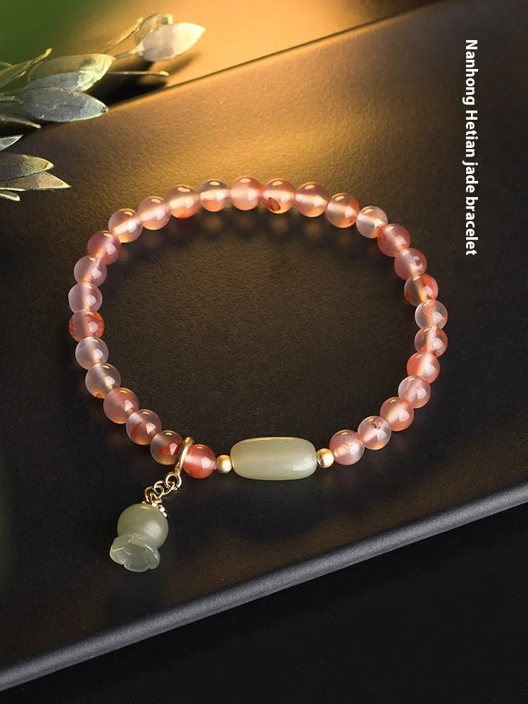 Nanhong agate bracelet with bamboo joint and floral design in ethnic style.