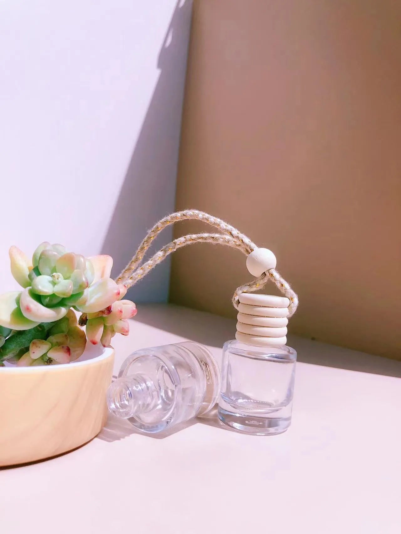 Glass car fragrance pendant showing Cylinder, Diamond, Flat Drum, and Square bottle style options.