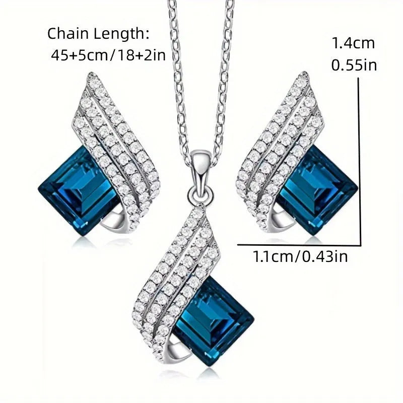 Women's electroplated alloy and glass jewellery set showing necklace with cross chain design and matching ear studs