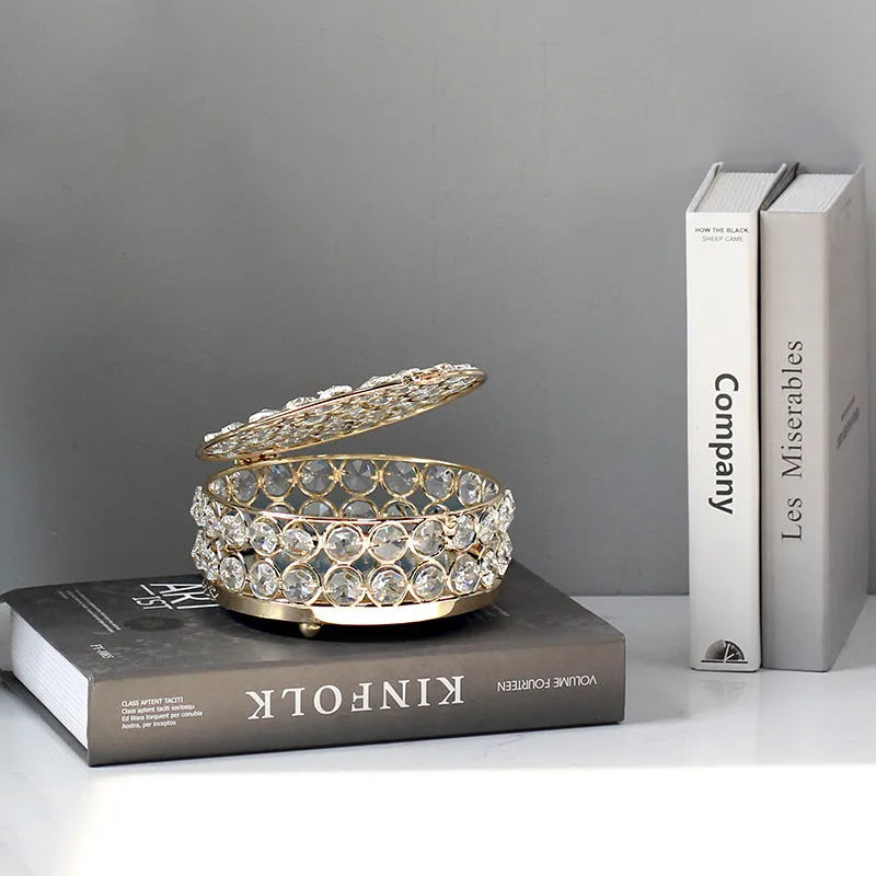 Transparent crystal glass jewelry box with a French gold metal frame in a European style.