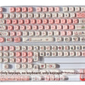 Close-up of a pink Fragrant Pig design on a white PBT plastic keycap for mechanical keyboards.