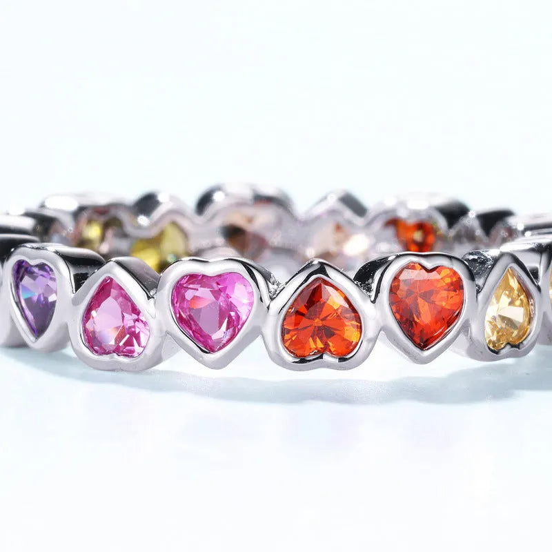 Silver love heart ring with coloured gems inlay and thick silver platinum finish, shown in US6 US7 US8 sizes