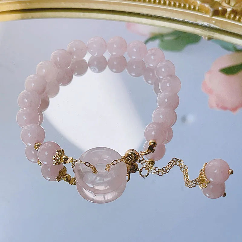 Pink crystal peace buckle bracelet on adjustable silver-plated chain for women