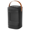Silver portable heater with digital touch screen display and remote control on a table.