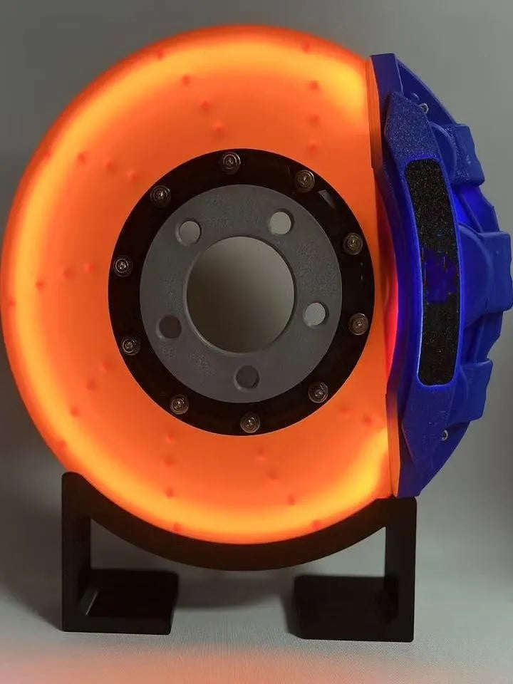 Brake disc design rechargeable LED night light with touch control in blue, red or yellow.