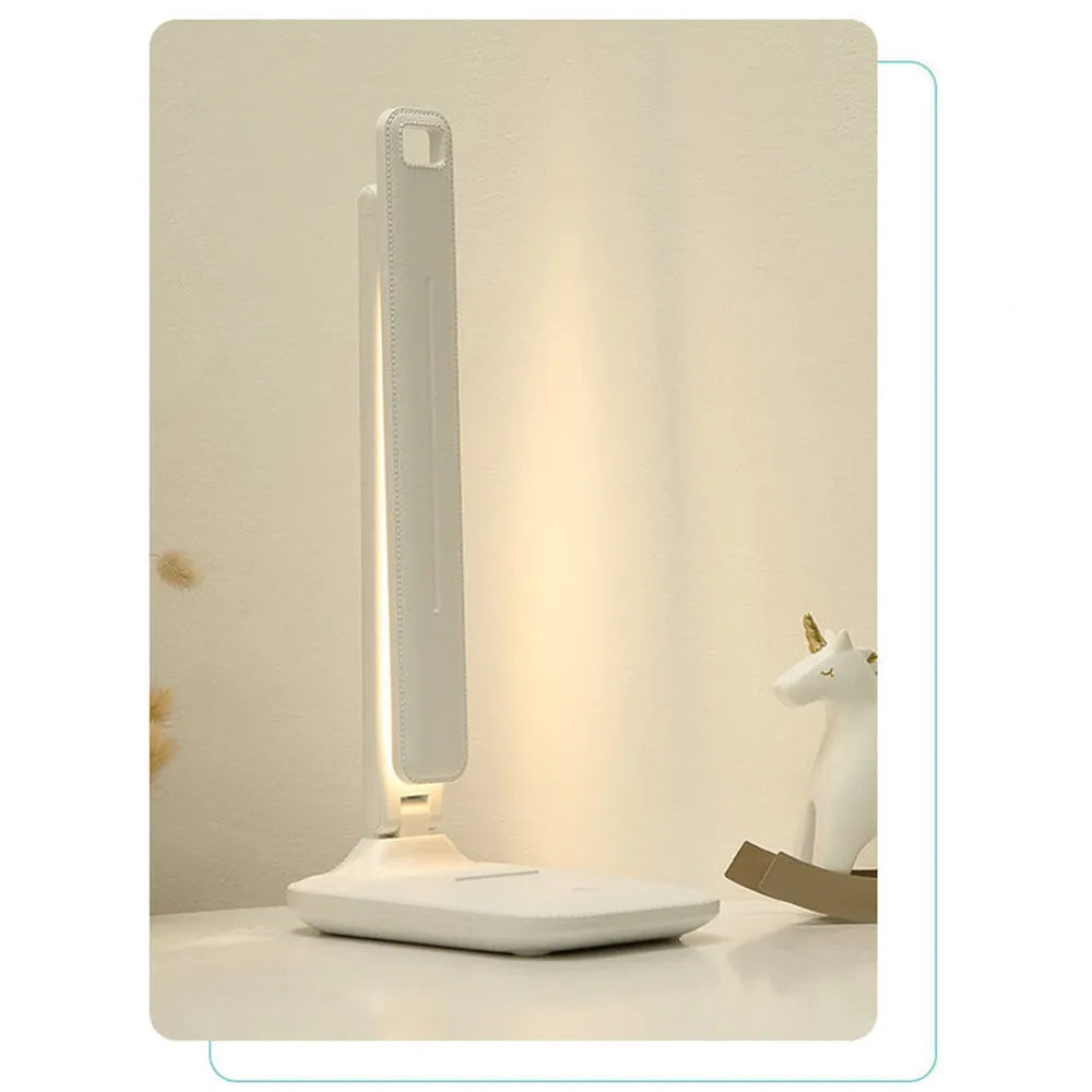 White plastic bedside lamp with touch dimming and USB charging port.