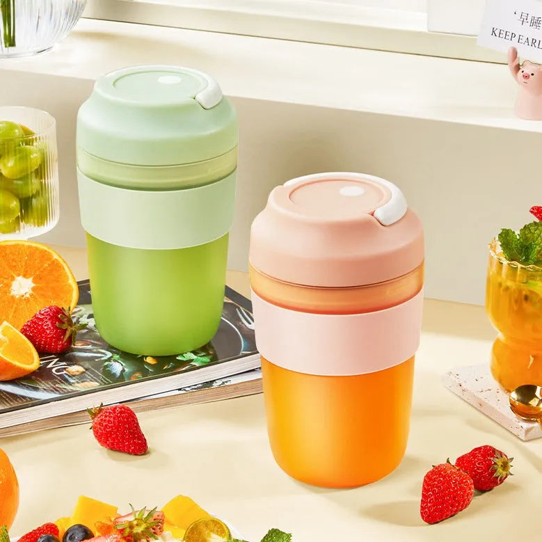 Portable purple blender cup with four stainless steel blades and a USB charging cable