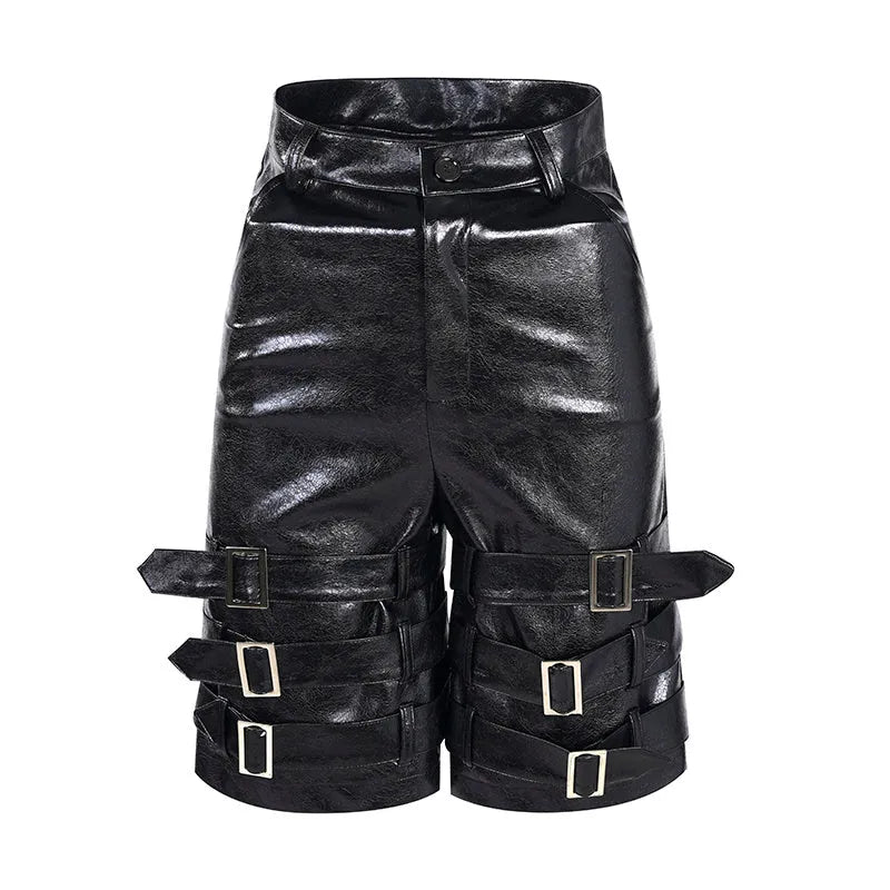Men's black PU leather cropped pants with a ring detail on low-waist shorts.