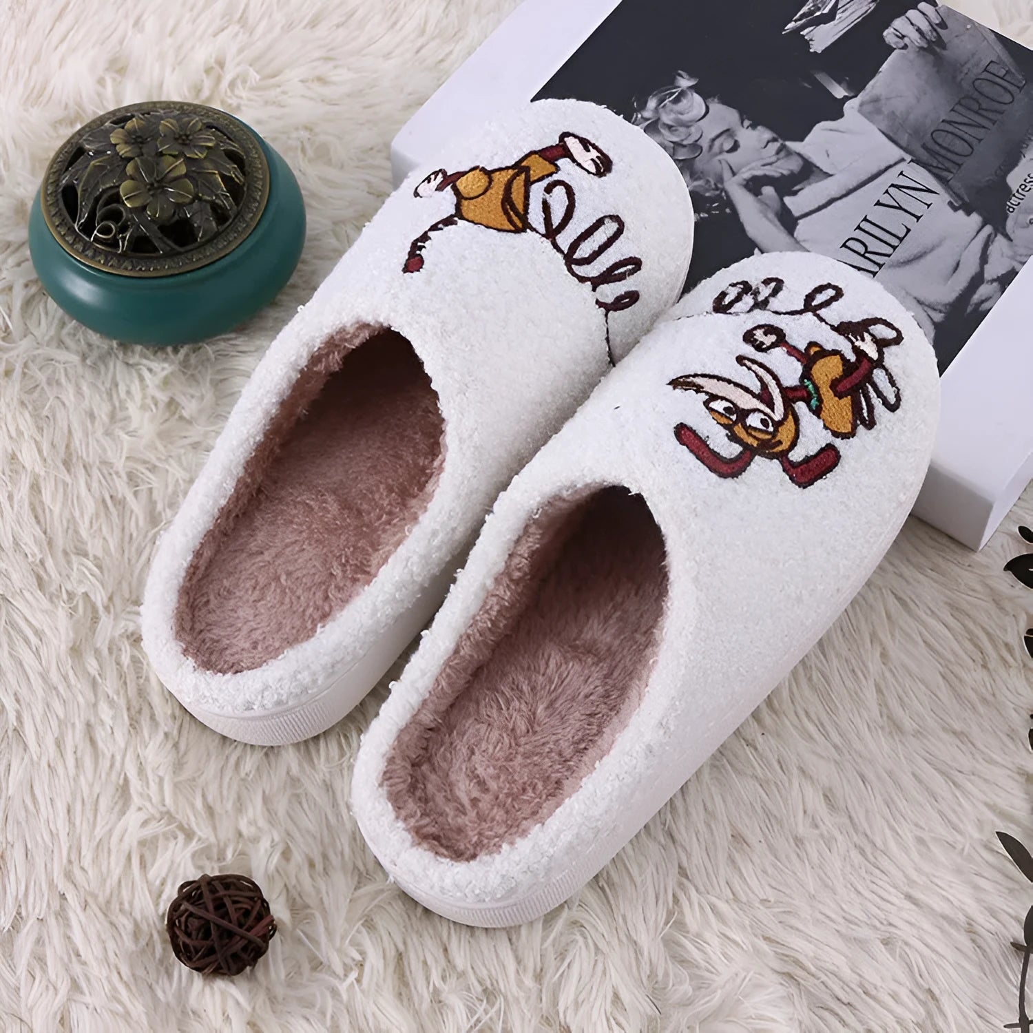 White cartoon pattern fluffy slippers with a non-slip rubber sole and toe holder design.