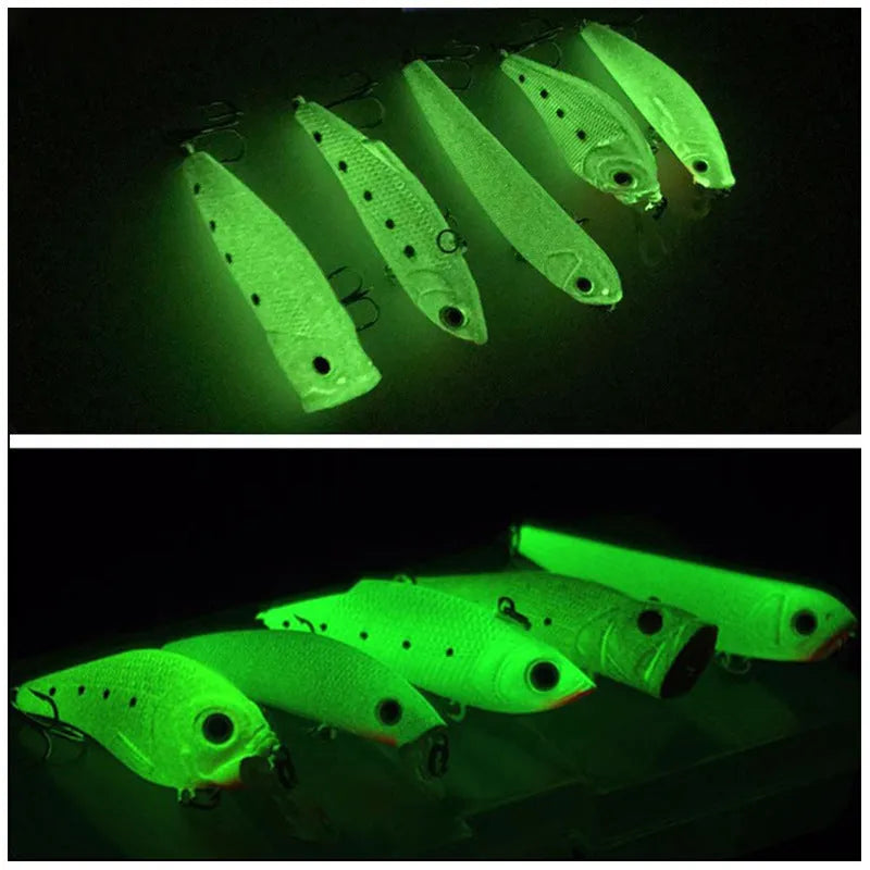 Set of five 3D fluorescent hard bait fishing lures with luminous effect on blue background.