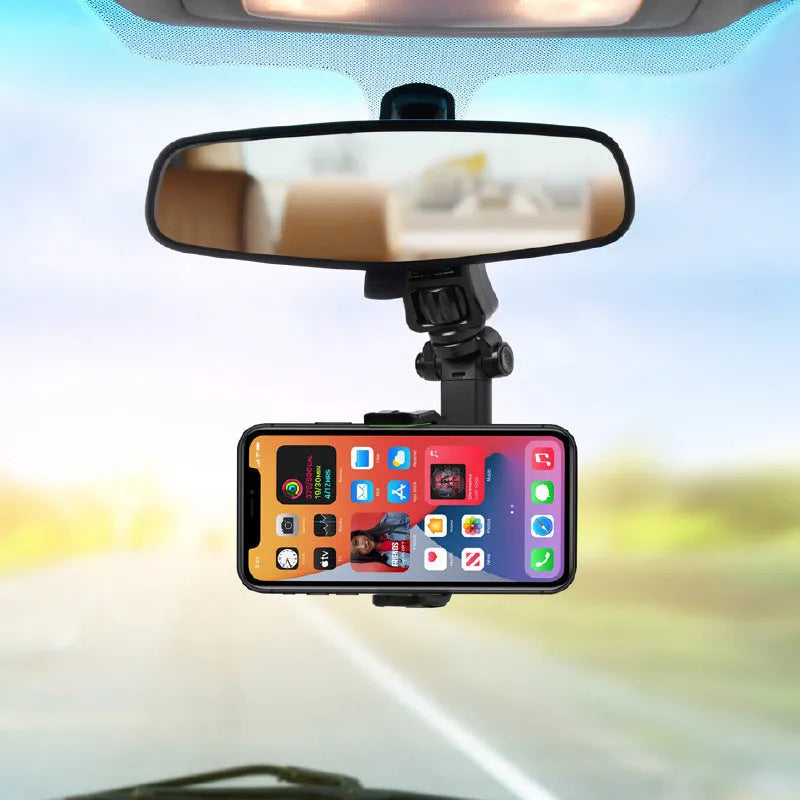 Black and green car mobile phone holder mounted on a rear-view mirror bracket.