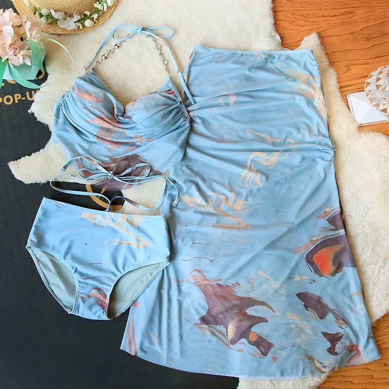 Women's blue printed bikini set with push-up top, bottoms, and removable skirt showing steel support structure