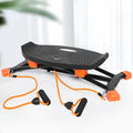 Black mini indoor skiing exercise machine with elastic hand straps, compact home cardio equipment.