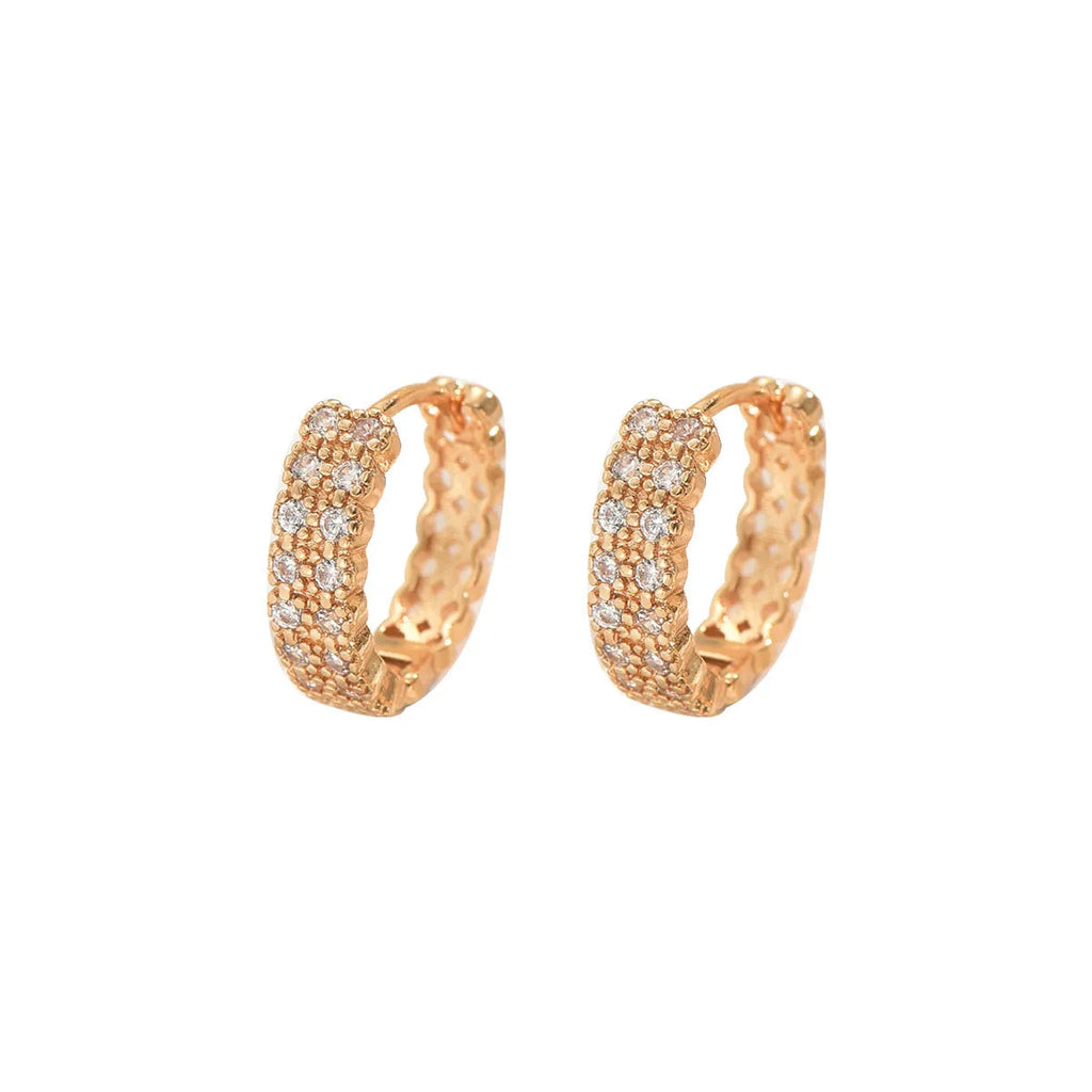 A pair of women's copper geometric ear studs with a dot and ring design, shown against a plain background.