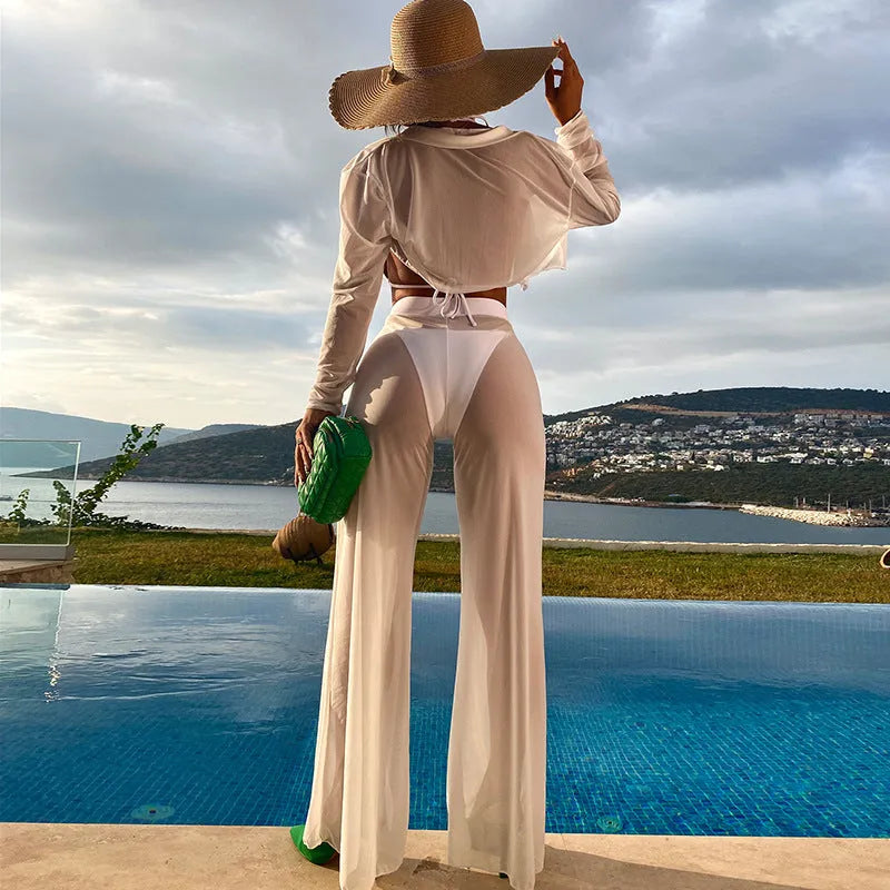 White women's four-piece swimsuit set showing backless top, high-waisted trousers, bra, and panties arranged together