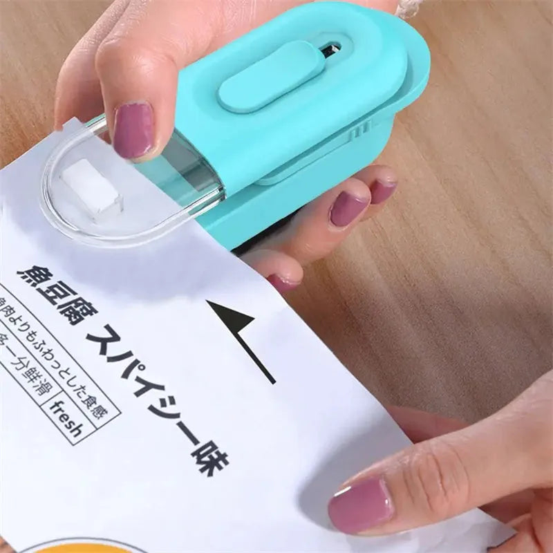 Handheld ABS bag sealer and resealer, 100x38x35mm, in black, white or Lake Blue